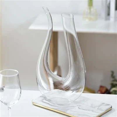How to present a wine decanter at a household dinner party?